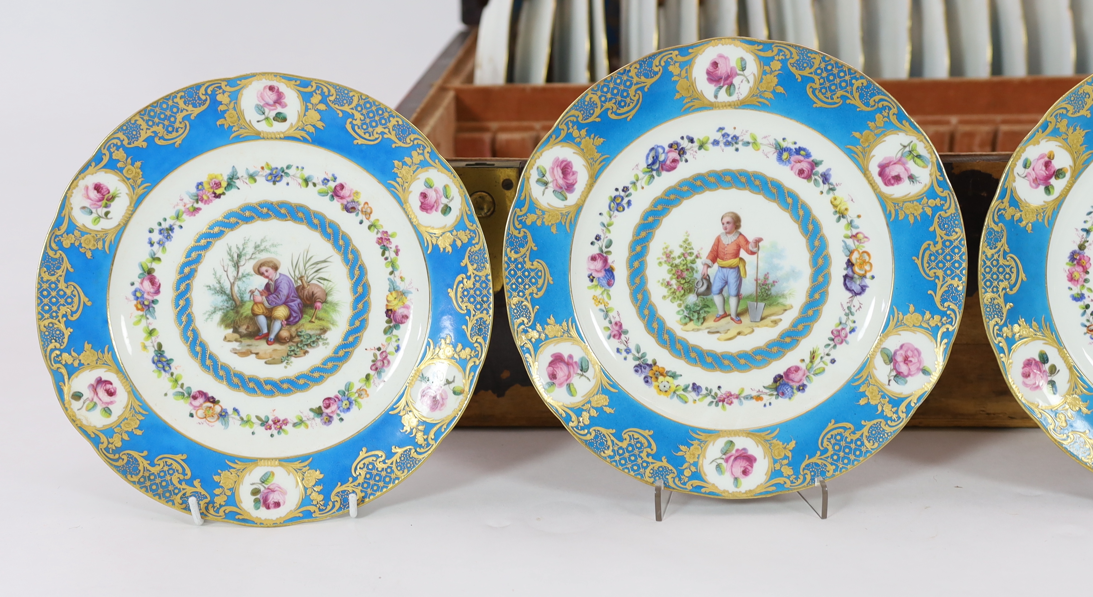 A cased set of twenty four Sevres style cabinet plates, 19th century